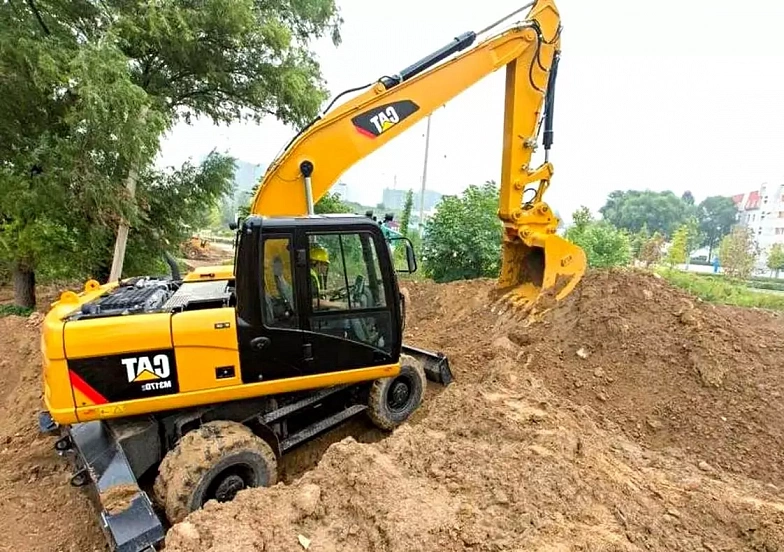 Колесный экскаватор Caterpillar M317D2 с грейфером